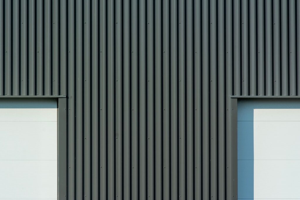 Close-up of corrugated metal siding panels on an exterior wall